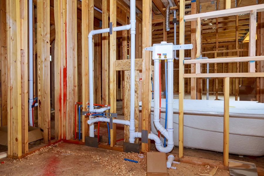 Residential bathroom rough-in with drain, vent, and supply lines